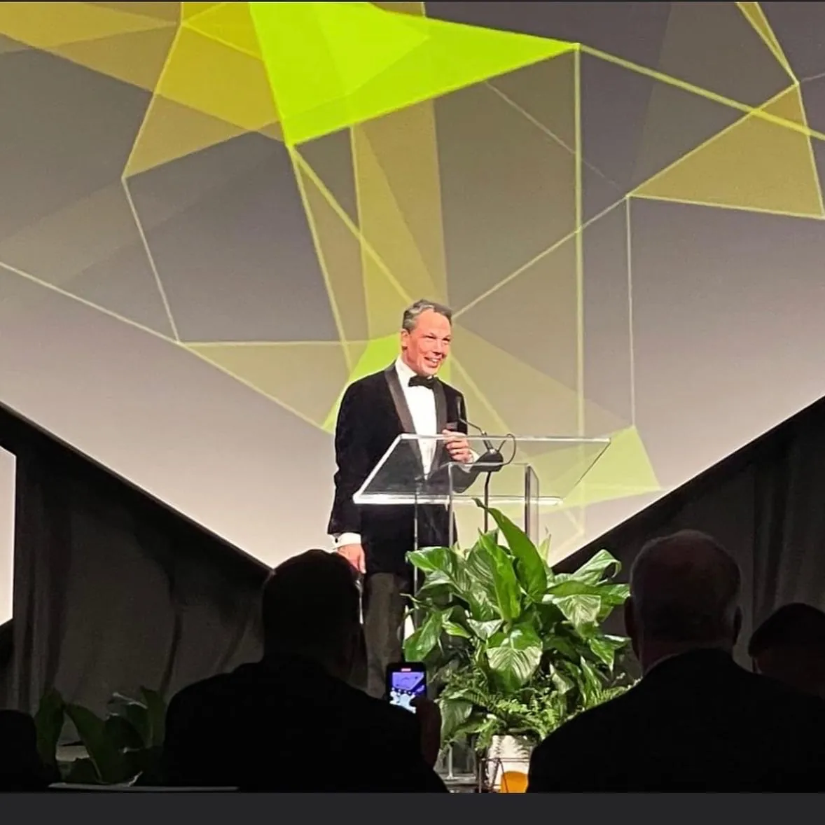 Roger Burnett delivering a keynote at the podium